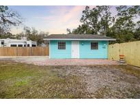 Cute light blue bungalow with a fenced yard at 3200 Tobero Ln, Sarasota, FL 34235