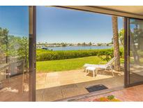 Relaxing patio with lounge chair and view of the water at 6200 Flotilla Dr # 241, Holmes Beach, FL 34217