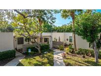 Attractive condo exterior with lush landscaping and private patio at 123 Pinehurst Dr, Bradenton, FL 34210
