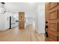 Light and airy entryway, showcasing modern kitchen and living area at 2321 Beneva Ter # 2288, Sarasota, FL 34232