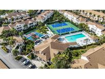 Aerial view of community featuring tennis courts, pool, and clubhouse at 8335 Glenrose Way # 1513, Sarasota, FL 34238