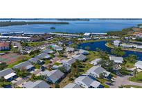Aerial view of a waterfront community with a home highlighted at 9413 Andover Cir, Bradenton, FL 34210