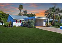 Charming ranch home with carport and landscaped lawn at 9413 Andover Cir, Bradenton, FL 34210