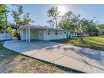 Newly renovated home with a carport and spacious driveway at 3107 34Th Avenue W Dr, Bradenton, FL 34205