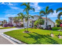 Beautiful two-story house with a tile driveway and lush landscaping at 3218 Big Sky Way, Bradenton, FL 34211