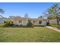 Single story home with a well-manicured lawn and driveway at 3503 18Th W Ave, Bradenton, FL 34205