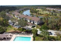 Aerial view of condo community, pool, and golf course at 5250 Hyland Hills Ave # 1525, Sarasota, FL 34241