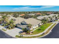 Aerial view of a charming villa community showcasing well-maintained homes and lush landscaping at 9367 Hawk Nest Ln, North Port, FL 34287