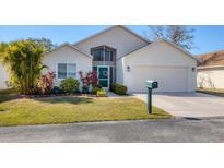 Charming one-story home with well-maintained landscaping and an attached two-car garage at 4018 38Th W St, Bradenton, FL 34205