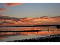 Stunning sunset over calm water with reflection at 6430 Sun Eagle Ln # 201, Bradenton, FL 34210