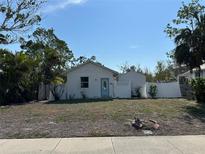 Cute cottage style home with fenced yard at 690 Broadway St, Longboat Key, FL 34228