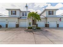 Well maintained townhomes with attached garages, manicured landscaping, and private drives at 17278 Acapulco Rd # 312, Punta Gorda, FL 33955