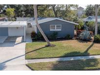 Charming single-story home with a well-maintained lawn and landscaping in a desirable neighborhood at 2321 Terry Ln, Sarasota, FL 34231