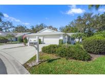 Well-maintained home with a manicured front lawn and a double-car garage at 3622 Bonaventure Ct, Sarasota, FL 34243