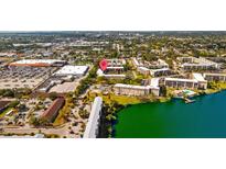 Aerial view of condo community near shopping center and waterfront at 4126 Heron Way # B113, Bradenton, FL 34205