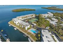 Aerial view of waterfront community with pool and boat slips at 4320 Falmouth Dr # 301, Longboat Key, FL 34228