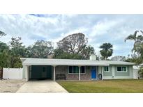 Charming ranch home with new paint, landscaping, and carport at 4522 Banan Pl, Sarasota, FL 34242