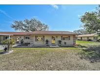 Charming single-story home with a well-maintained lawn, mature trees, and a welcoming entrance at 4565 Mohican Trl # 129, Sarasota, FL 34233