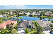 Luxury home community with lake views; single-Gathering homes with lush landscaping at 4921 Woodhurst Dr, Sarasota, FL 34243