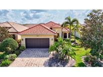 Attractive single-story home with a tile roof and landscaped yard at 6207 27Th E St, Ellenton, FL 34222