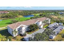 Beautiful condo building overlooking the golf course, lake, and landscape at 8755 Olde Hickory Ave # 7302, Sarasota, FL 34238