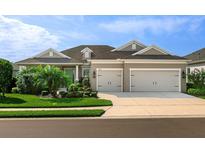 Beautiful one-story home with a well-manicured lawn, two-car garage, and tropical landscaping at 13922 Old Creek Ct, Parrish, FL 34219