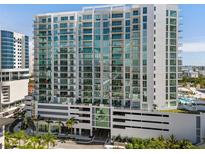 Luxury high rise condo building features modern architecture, balconies, and stunning city views at 301 Quay Commons # 1809, Sarasota, FL 34236