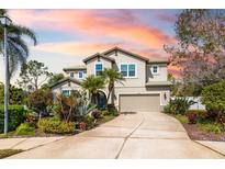 Beautiful two-story home with meticulously landscaped front yard and covered front entryway at 6807 46Th E Ter, Bradenton, FL 34203