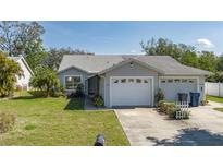 Charming single-story home with well-maintained lawn and two-car garage at 5441 18Th W Ct, Bradenton, FL 34207