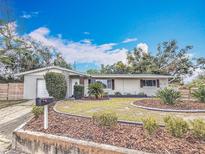 Charming single-story home featuring a well-manicured lawn and inviting curb appeal at 6772 113Th St, Seminole, FL 33772