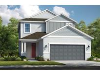 Two-story home with gray siding, red door, and two-car garage at 8465 Skye Ranch Blvd, Sarasota, FL 34241