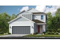 Two-story home with gray siding, gray garage door, and red front door at 9113 Night Skye Ave, Sarasota, FL 34241