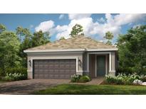 Charming single-story home featuring a two-car garage, neutral color palette, and well-maintained landscaping at 26936 Lark Ct, Punta Gorda, FL 33955