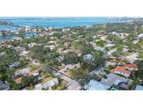 Sprawling property with mature trees on a street ending at the bay, near open water and beaches at 3716 Camino Real, Sarasota, FL 34239