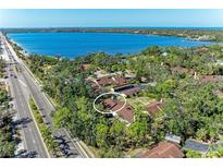 Beautiful aerial view of a condo community surrounded by lush greenery and a scenic waterfront at 7921 4Th W Ave, Bradenton, FL 34209