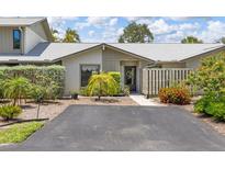Charming single-story home featuring a well-maintained front yard and inviting entrance at 155 Jose Gaspar Dr # 155, Englewood, FL 34223