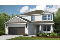 Charming two-story home features a two car garage and manicured lawn at 8513 Golden Dawn Ct, Sarasota, FL 34241