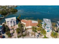 Stunning waterfront home with a private dock and lush tropical landscaping in a beautiful coastal community at 236 S Harbor Dr # Lot 35, Holmes Beach, FL 34217