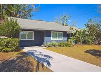 Charming single-story home featuring a well-maintained lawn and a long private driveway at 2785 Sydelle St, Sarasota, FL 34237