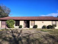 Charming single-story home featuring a well-maintained lawn and cozy curb appeal at 3252 Patton St, Sarasota, FL 34235