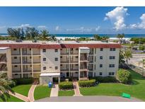 Low-rise beachfront condo building with well-maintained landscaping and access to the ocean at 901 Beach Rd # 402, Sarasota, FL 34242