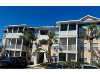 Attractive condo building featuring multiple stories, screened in balconies, and tasteful landscaping at 4802 51St W St # 1210, Bradenton, FL 34210