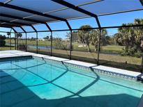 Screened-in pool with tile border overlooks a golf course and water feature for stunning backyard views at 3837 Torrey Pines Blvd, Sarasota, FL 34238