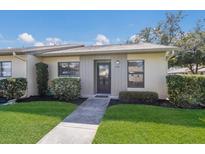 Charming single-story home featuring well-maintained landscaping and a welcoming front entrance at 2720 60Th Avenue W Dr # D, Bradenton, FL 34207