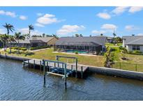 Waterfront home with a private pool and dock, offering direct access to the canal at 4196 Eastlake Ct, Port Charlotte, FL 33948