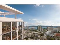 Stunning high-rise building with modern architecture and expansive views of the city skyline and bay at 1703 Main St # Ph 3, Sarasota, FL 34236