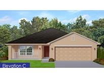 Charming one-story home featuring a covered front porch, two-car garage, and neutral exterior paint at 2652 Averland Loop, North Port, FL 34287