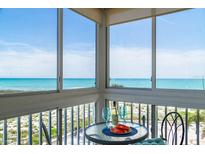 Stunning ocean view from the balcony with outdoor seating, featuring clear blue skies and refreshing sea breezes at 1255 Tarpon Center Dr # 315, Venice, FL 34285
