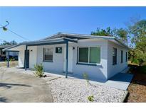 Charming single-story home featuring a fresh exterior paint, a covered entry, and minimal landscaping at 321 40Th Street Nw Ct, Bradenton, FL 34209
