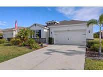Lovely home with a spacious driveway and a well-kept lawn at 4034 Mossy Limb Ct, Palmetto, FL 34221